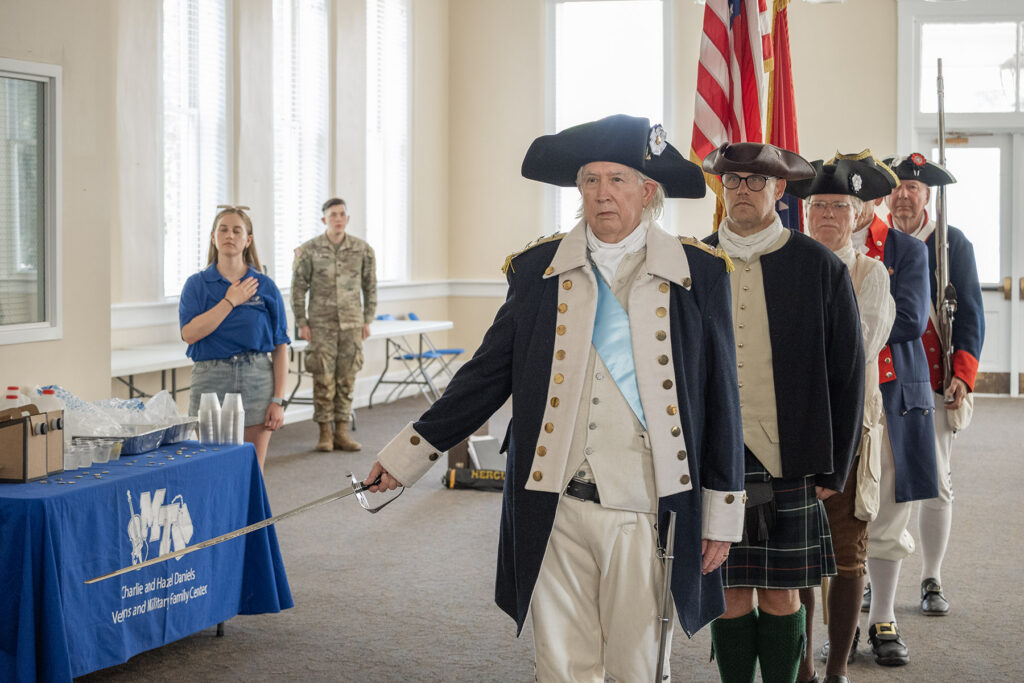 In honor of the sacrifice of our first American veterans in the War of Independence, reenactors present the colors during the Veterans Memorial Service in Middle Tennessee State University’s Tom Jackson building ahead of the Veterans Village picnic and Salute to Veterans and Armed Forces football game on Sept. 19, 2026, in Murfreesboro, Tenn. (MTSU photo by Cat Curtis Murphy)