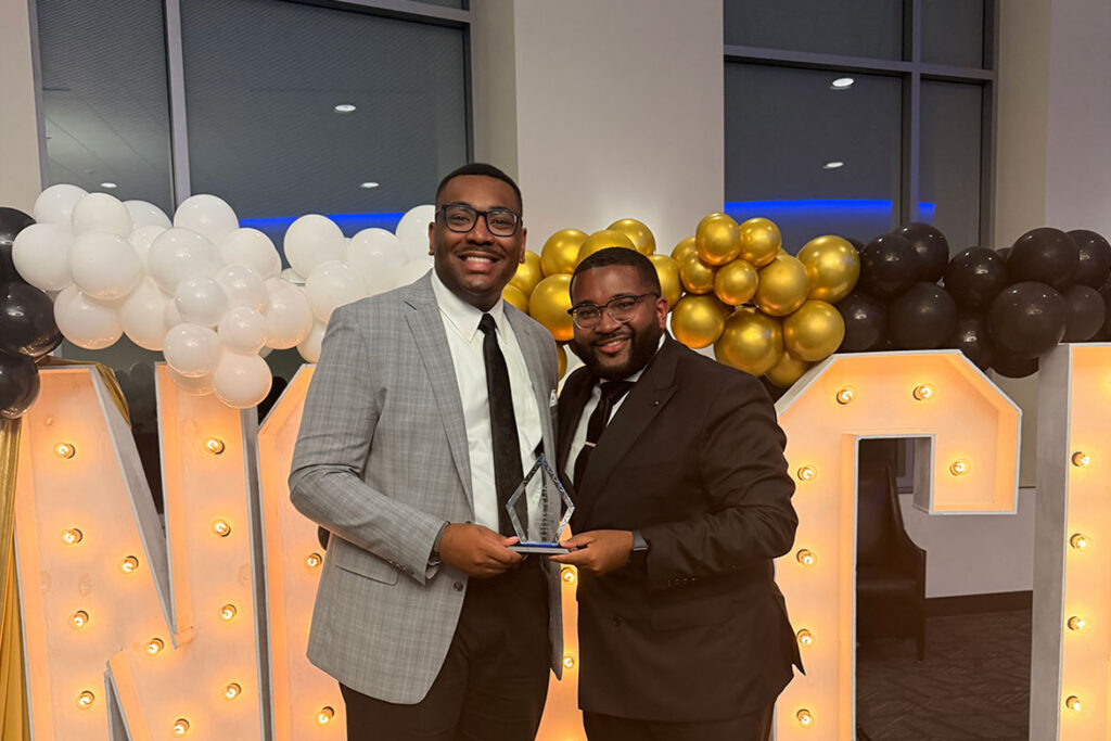 Middle Tennessee State University graduate student RJ Ware holds his “Youth of the Year” award from the Murfreesboro branch of the National Association for the Advancement of Colored People alongside alum and mentor Michai Mosby, now strategic marketing and communications specialist for Student Affairs, presented to Ware at the NAACP’s Freedom Fund Gala in the Student Union Building on the Murfreesboro, Tenn., campus on Saturday, Aug. 22, 2026. (Submitted photo)