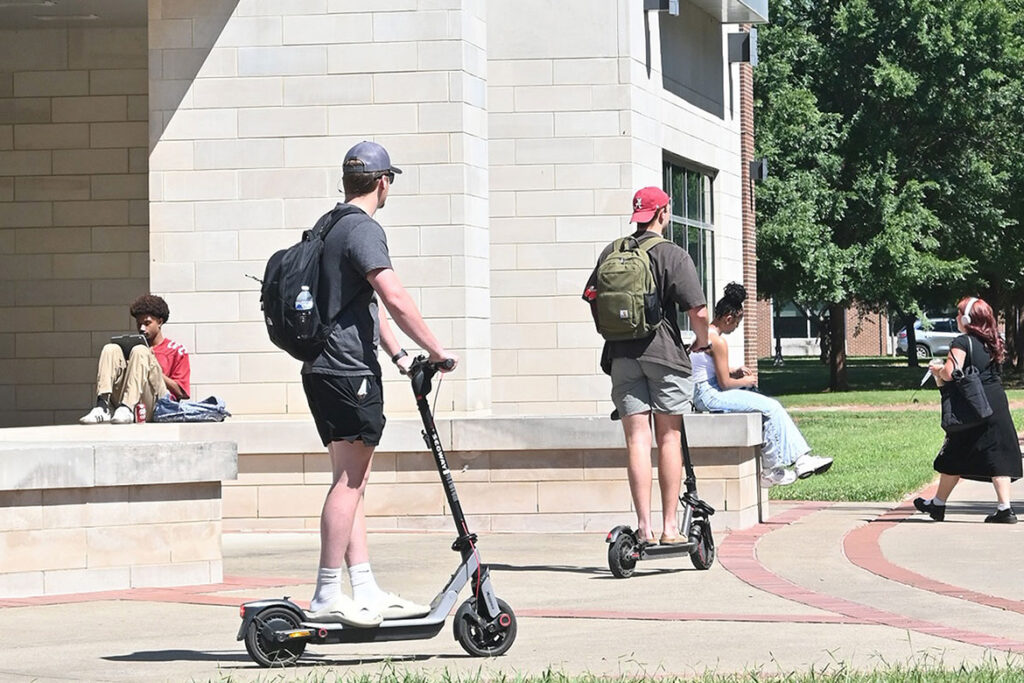 In this file photo, two Middle Tennessee State University students ride scooters on the Murfreesboro, Tenn. campus. (MTSU Photo)