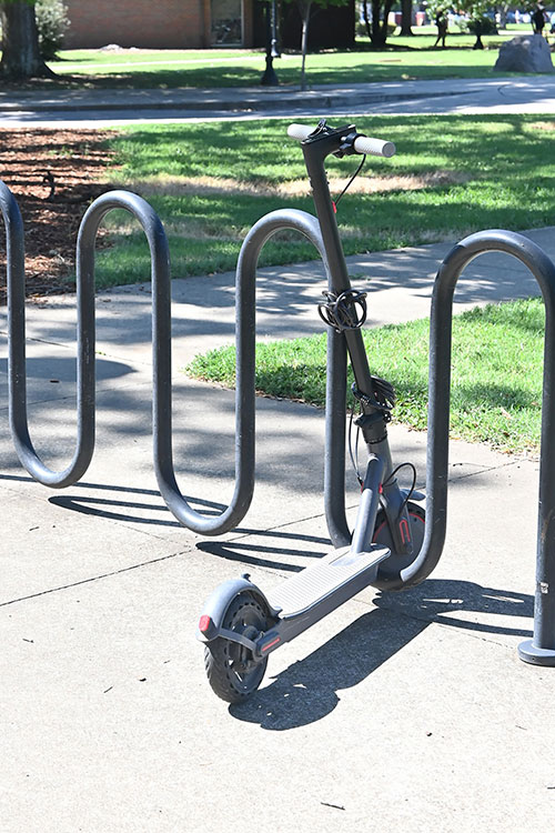 In this file photo, a scooter is locked up on a bike rack on Middle Tennessee State University's campus in Murfreesboro, Tenn. (MTSU Photo)