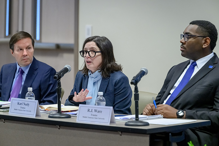 Kari Neely, center, the faculty trustee on the Middle Tennessee State University Board of Trustees, makes a point during the board’s quarterly meeting on Monday, Sept. 28, 2026, at the Miller Education Center on campus in Murfreesboro, Tenn. Looking on are Trustee Chad White, left, and Student Trustee RJ Ware.