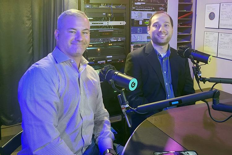 Dr. Jack Villanova, right, assistant professor of physics and associate director of research for Middle Tennessee State University’s QRISE Center, and Brandon Wagner, vice president of strategy with Middle Tennessee Electric, prepare to be interviewed on the “Action Line” program about a quantum research partnership on Aug. 17, 2026, from WGNS Radio’s downtown Murfreesboro, Tenn., studio. (MTSU photo by Jimmy Hart)
