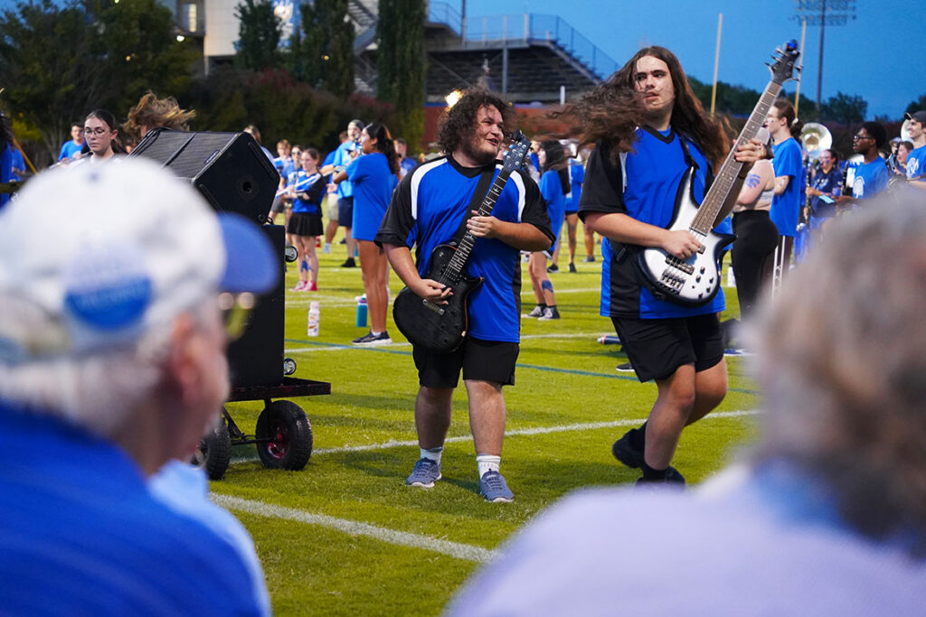 Middle Tennessee State University Band of Blue donors and performers look on as guitarists perform during the final evening of band camp Aug. 21, 2026, on campus in Murfreesboro, Tenn. The School of Music and MTSU development office invited supporters of the “Where Every Note Counts” campaign to meet scholarship recipients and watch the band perform. (MTSU photo by Mike Davis) 