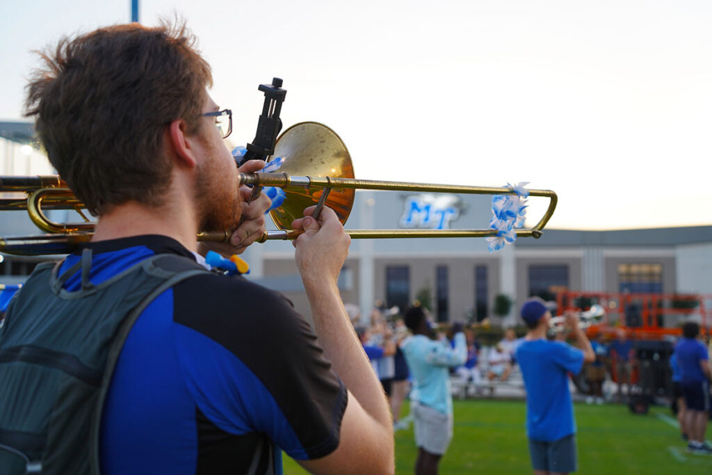 A Middle Tennessee State University Band of Blue member plays the trombone during the band’s final evening of band camp Aug. 21, 2026, on campus in Murfreesboro, Tenn. The annual camp brings Band of Blue members together for weeks of rehearsals and preparation leading up to the fall semester and football season. (MTSU photo by Mike Davis)