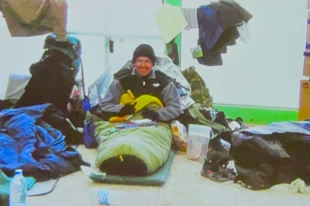Retired Tennessean reporter and Middle Tennessee State University School of Journalism and Strategic Media professor Leon Alligood sits in his makeshift bed in the media hub in the Kandahar Airport in Kandahar City, Afghanistan, in 2002 while embedded with the 101st Airborne Division based out of Clarksville, Tenn. (Photo submitted)