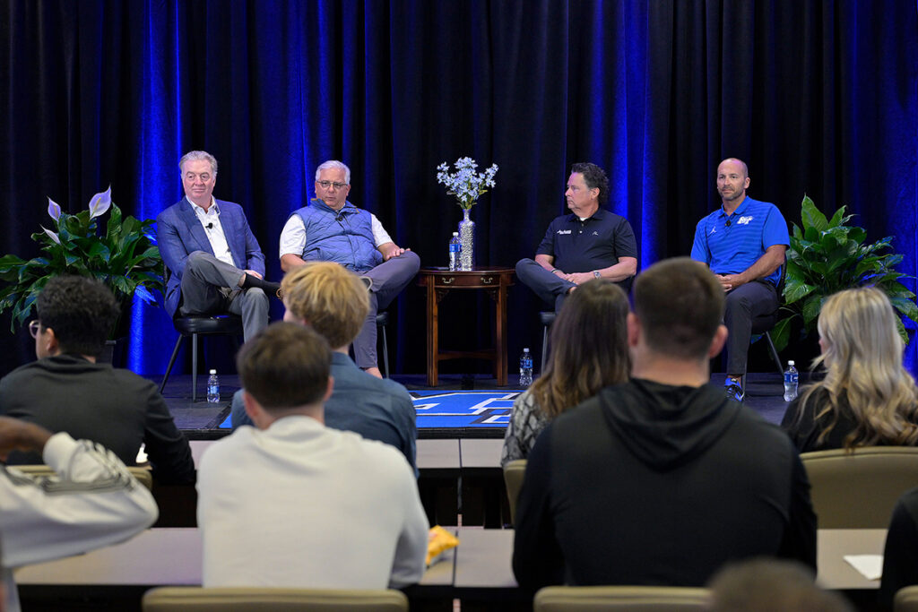 On stage, from left, Middle Tennessee State University Trustee John Floyd, founder of Ole South Properties, Colby Jubenville, professor and director of MTSU’s Center for Student Coaching and Success, Eric Blankenship, co-owner of All Access Coach Leasing, and Jimmy Borendame, MTSU men’s tennis coach, participate in a live student coaching and Q&A session on Tuesday, Oct. 6, 2026, inside a second-floor meeting room of the Miller Education Center on Bell Street, which houses the center. (MTSU photo by Andy Heidt).