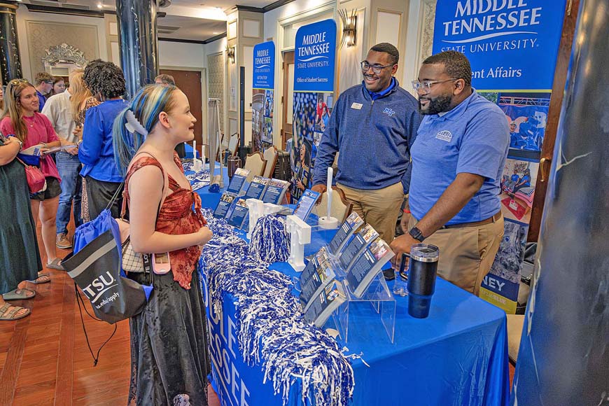A Johnson City high schooler, left, talks with Middle Tennessee State University Student Affairs representatives R.J. Ware, center, graduate fellow, and strategic communications manager Michai Mosby, right, during a True Blue Tour student recruitment stop at Carnegie Hotel in Johnson City, Tenn., when dozens of prospective students learned about the academic offerings at the Murfreesboro, Tenn., university. (MTSU photo by Nancy DeGennaro)