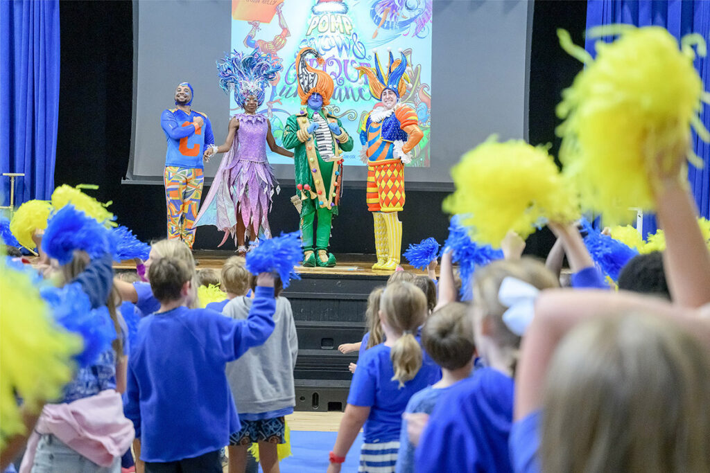 From left, an acrobat and the characters Snow, Pomp and Cirqueumstance stand onstage as Homer Pittard Campus School students give them a standing ovation following their performance during a special holiday-themed literacy event on Oct. 22, 2026, in Murfreesboro, Tenn. (MTSU photo by J. Intintoli)