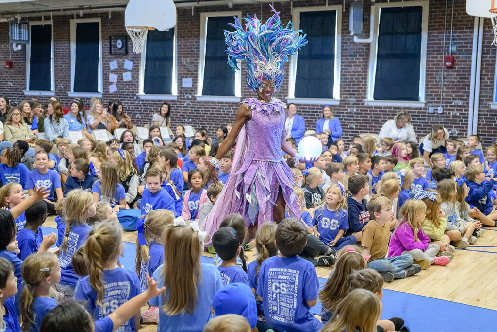 The character Snow walks through the audience toward the stage as Homer Pittard Campus School students watch during a special holiday-themed literacy event featuring a mini-performance from the “POMP, SNOW & CIRQUEumstance” production on Oct. 22, 2026, in Murfreesboro, Tenn. The event was a partnership between Middle Tennessee State University’s College of Education and Gaylord Opryland Resort, where the cirque production returns to Gaylord Opryland this season. (MTSU photo by J. Intintoli)