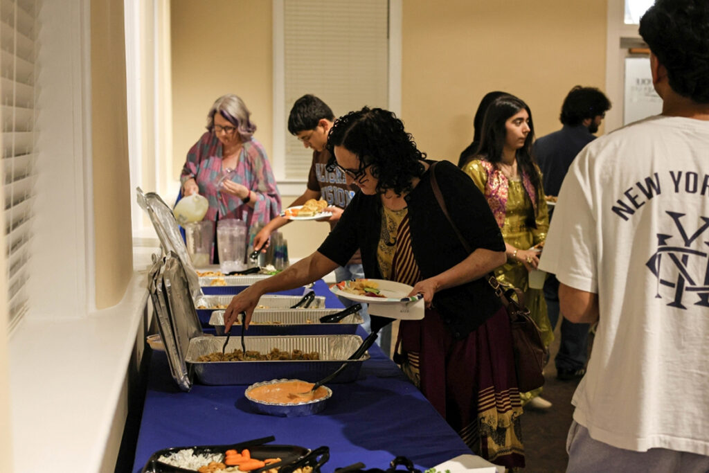 Gala attendees help themselves to traditional Middle Eastern food at the Culture Gala hosted by SWANA (Southwest Asia and Northeast Africa) student organization at Middle Tennessee State University in Murfreesboro, Tenn., on Oct. 5, 2026. (MTSU photo by Katelynn Liedtke).