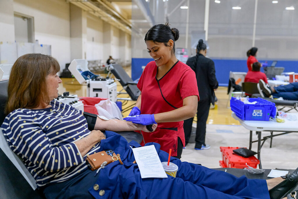 Middle Tennessee State University staff member Phyllis Pugh, left, talks with American Red Cross phlebotomist Ileana Rodriguez at the 2025 “100 Miles of Hope” blood drive held in the Campus Recreation Center on campus in Murfreesboro, Tenn. This year’s blood drive — a friendly rivalry between the MTSU Blue Raiders and Western Kentucky Hilltoppers — is set for 11 a.m. to 5 p.m. Monday-Wednesday, Nov. 2-4, in the same location. Whichever university garners the most donations in the three-day blood drive wins the coveted challenge trophy to display. (MTSU file photo by J. Intintoli)