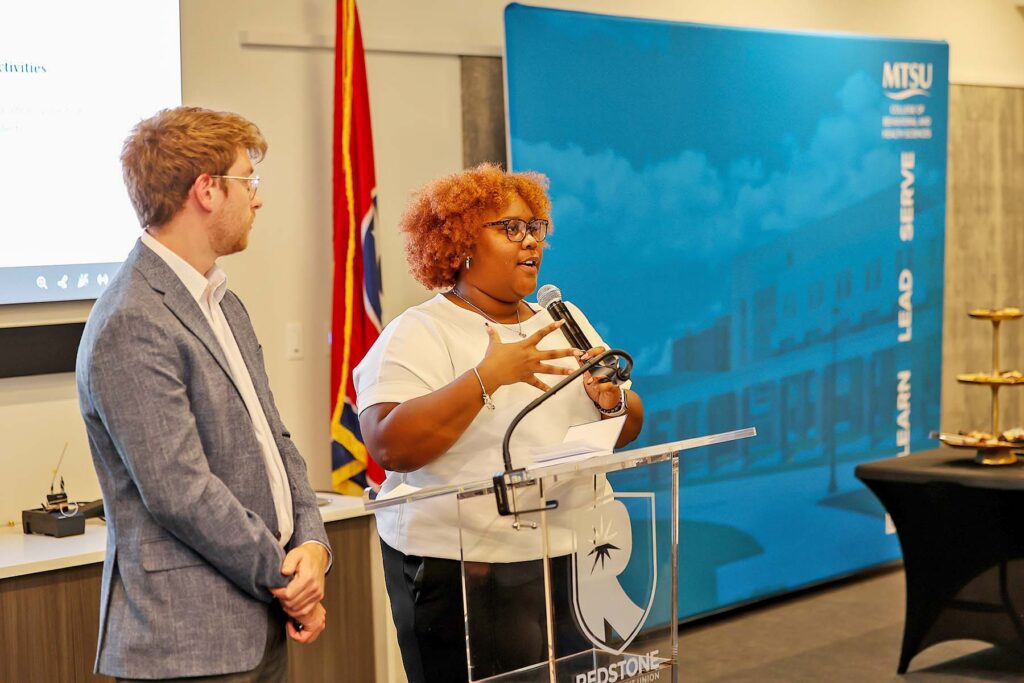 Greylon Gawaluck, left, and Hailey Russell, both Public Health Program students from Middle Tennessee State University in Murfreesboro, Tenn., give a presentation at the program’s annual PHamily Dinner held in September 2026. (Submitted photo)