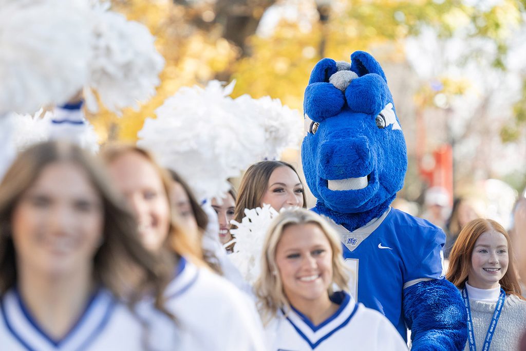 In this file photo, Middle Tennessee State University’s spirit program, including mascot Lightning, marches in Raider Walk during tailgating tradition Party in the Grove on campus in Murfreesboro, Tenn. This year’s Homecoming tailgate features independent singer-songwriter Grace Leer at 12:30 p.m. Her performance is bookended by Raider Walk at noon and the Follow Me to Floyd march at 2 p.m. (MTSU file photo by Cat Curtis Murphy)